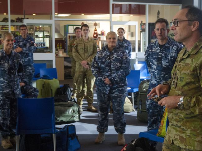 Colonel David Hughes, (right) addresses Australian Defence Force personnel and members of the Australian Medical Assistance Team at Burnie Airport before they leave Tasmania following their support to Burnie’s North West Regional Hospital.