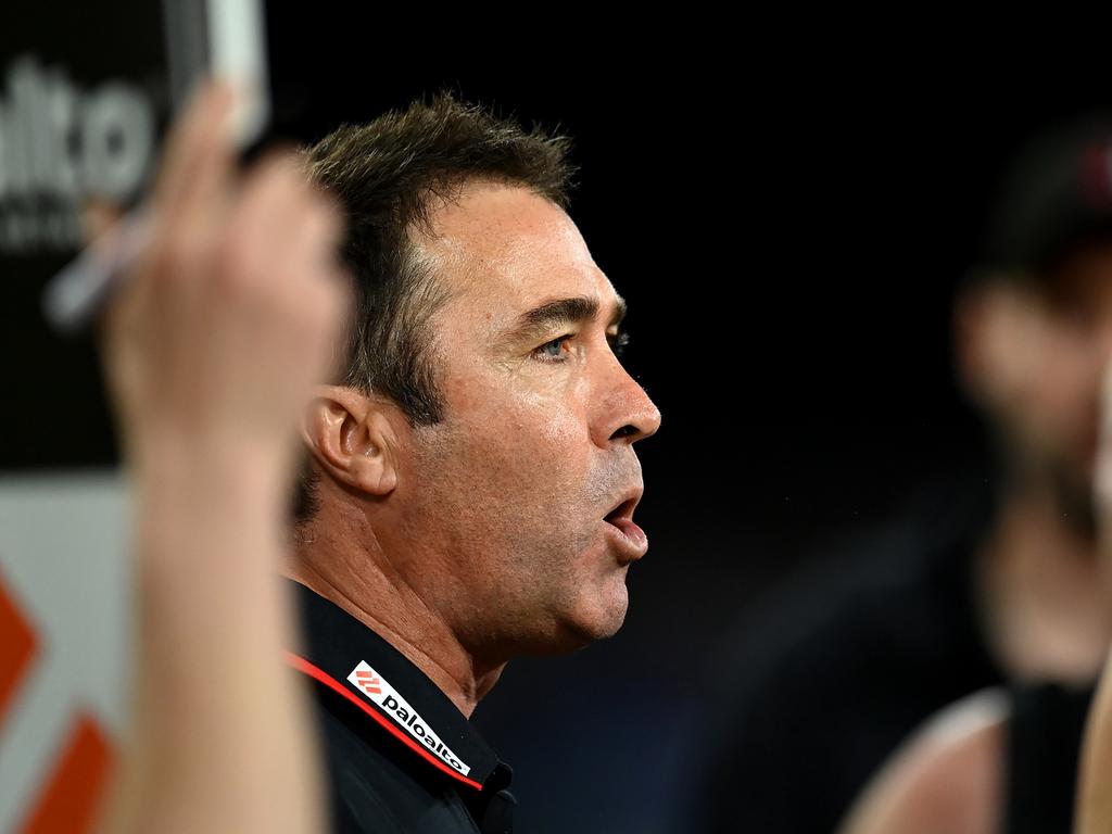 Bombers head coach Brad Scott speaks to players during a break on the Gold Coast. Picture: Albert Perez/AFL Photos via Getty Images.