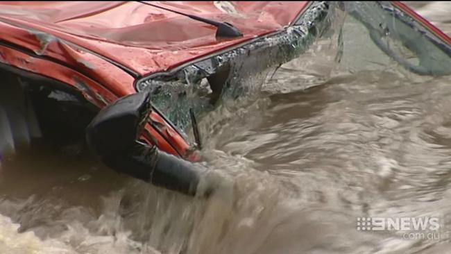 A car in the Flooded Cotter River near Canberra where a man's body was found after the storms. Picture CH 9