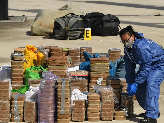 Police remove a large amount of methamphetamine from a yacht docked at Balmain in Sydney, Sunday, April 19, 2020. A yacht carrying a suspected hundreds of kilograms of methamphetamine has been intercepted off the NSW coast near Lake Macquarie, leading to two arrests. (AAP Image/Joel Carrett) NO ARCHIVING