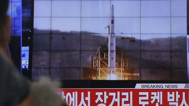 FILE - In this Feb. 7, 2016, photo, a South Korean man watches a TV news program with a file footage about North Korea's rocket launch at Seoul Railway Station in Seoul, South Korea. North Korean nuclear and rocket tests are drawing quick responses from the U.S. that will upset a supposed partner against Pyongyang's weapons development _ China. New efforts to toughen missile defense in South Korea and sanctions legislation moving swiftly through Congress could both hurt Chinese interests. The Chinese are concerned the missile defense system could be used against them, and the U.S. sanctions could hit Chinese companies that trade with North Korea. (AP Photo/Ahn Young-joon)