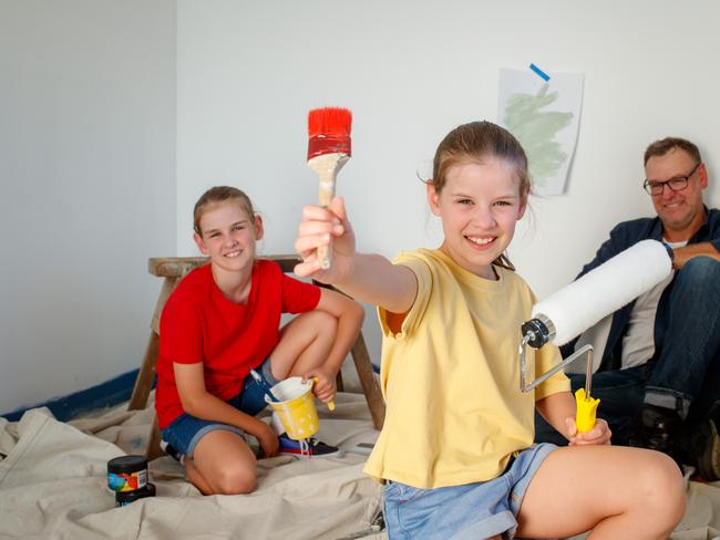 Matt Carman with daughters Adeline and Lil, who have been progressively fixing their home. Picture Matt Turner.