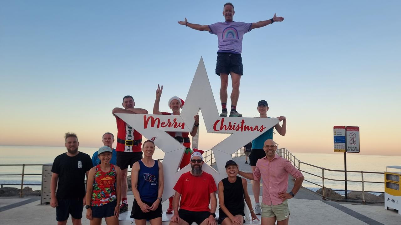 Adelaide runner Asa Cowell (on the star) joined by fellow runners early Christmas morning. Picture: Supplied