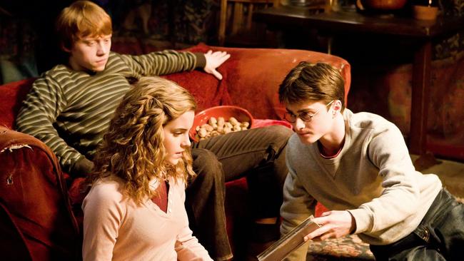 Actors Rupert Grint (rear), Emma Watson and Daniel Radcliffe in a scene from Harry Potter and the Half-Blood Prince.