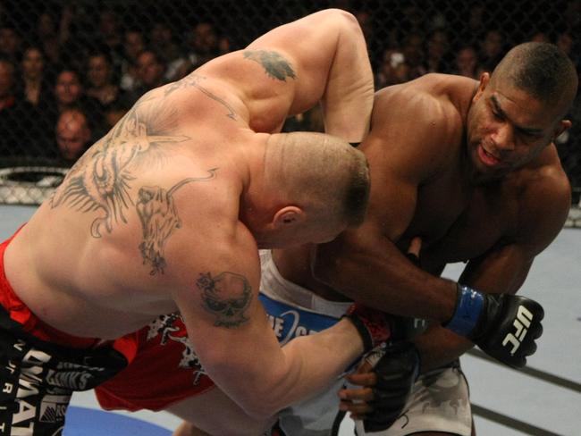 Alistair Overeem (right) punches Brock Lesnar during UFC 141 in 2011.