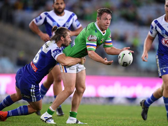 Sam Williams of the Raiders offloads a pass as he is tackled by Kieran Foran of the Bulldogs during the Round 12 NRL match between the Canterbury Bankstown Bulldogs and the Canberra Raiders at ANZ Stadium in Sydney, Saturday, June 1, 2019. (AAP Image/Dan Himbrechts) NO ARCHIVING, EDITORIAL USE ONLY