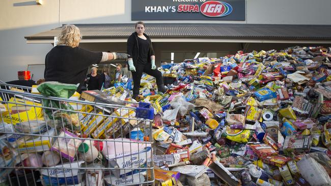 Heavy losses: The Picton IGA was left with a pile of spoiled stock — although some of it was washed down the street. <i>Picture: News Corp</i>