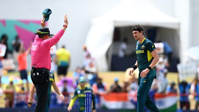 Mitchell Starc of Australia reacts after being hit for a six by Rohit Sharma. (Photo by Gareth Copley/Getty Images)