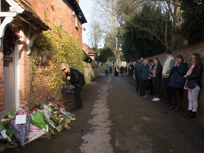 Fans line up outside the Oxfordshire home of British pop singer George Michael. Picture: Carl Court/Getty Images