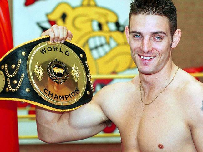 McKinnon with his World Kick Boxing Champion belt in 2000. Picture: Mike Szabath 