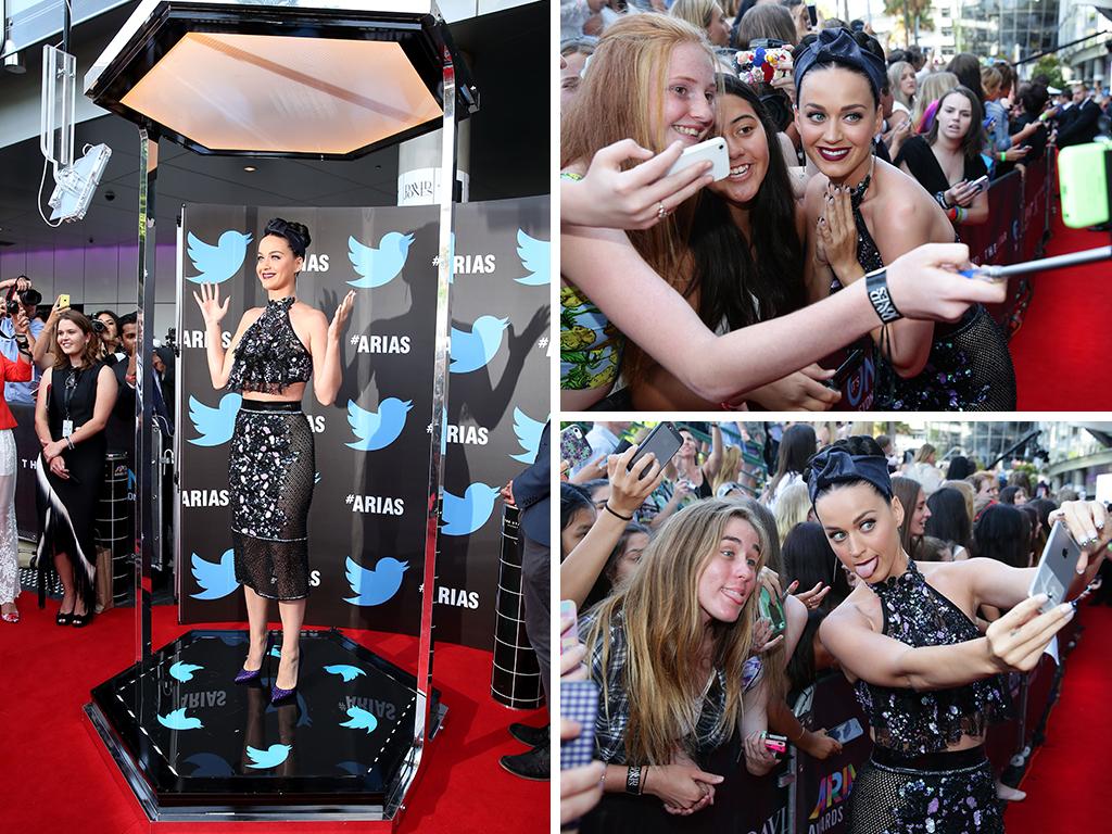 Katy Perry takes selfies with fans on the red carpet at the ARIA Awards 2014 in Sydney, Australia. . Pictures: Getty/Cameron Richardson