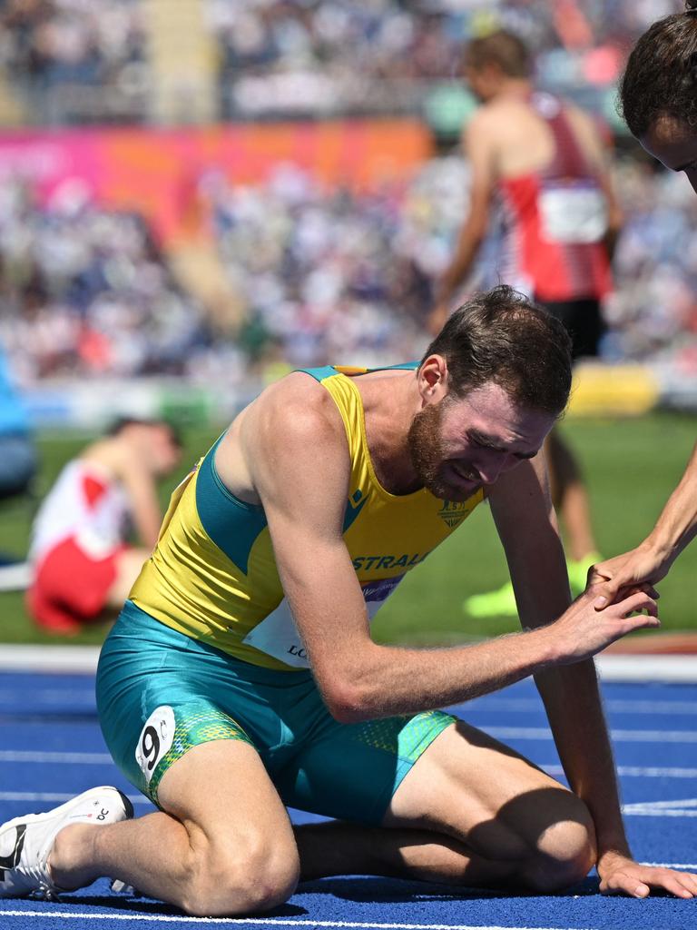 Hoare broke down after his historic run. (Photo by Glyn KIRK / AFP)