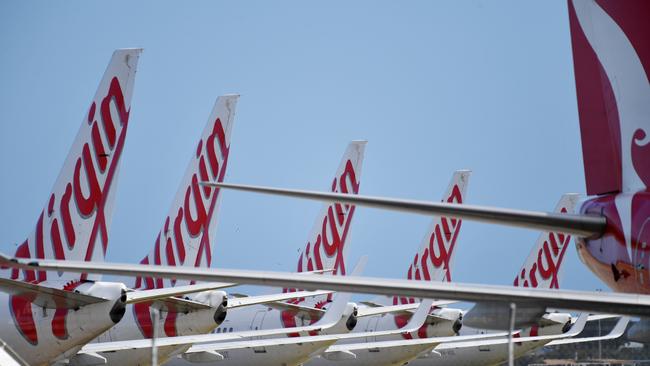 Most of Virgin Australia’s fleet remains grounded on tarmacs around the country as the company was put in voluntary administration yesterday. Picture: David Mariuz/AAP