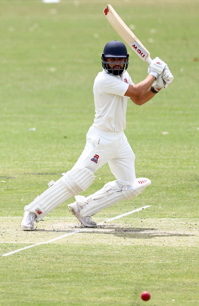 Shobit Singh laces a ball to the fence. (Photo by Josh Chadwick)