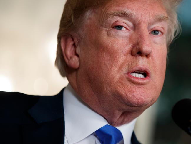 FILE - In this March 22, 2018, photo, President Donald Trump speaks before he signs a presidential memorandum imposing tariffs and investment restrictions on China in the Diplomatic Reception Room of the White House, in Washington. South Korea says it is trying to find out what President Donald Trump meant when he made remarks linking the recently renegotiated South Korea-U.S. free trade agreement with talks on denuclearizing North Korea. South Korean President Moon Jae-in's office said Friday, March 30, 2018, that it is working through various channels to find out the President Trump's intentions following his speech in Ohio.(AP Photo/Evan Vucci, File)