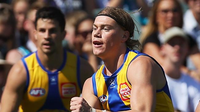 ADELAIDE, AUSTRALIA - MARCH 17: Harley Reid of the Eagles is tackled by Charlie Dixon of the Power during the 2024 AFL Round 01 match between the Port Adelaide Power and the West Coast Eagles at Adelaide Oval on March 17, 2024 in Adelaide, Australia. (Photo by James Elsby/AFL Photos via Getty Images)