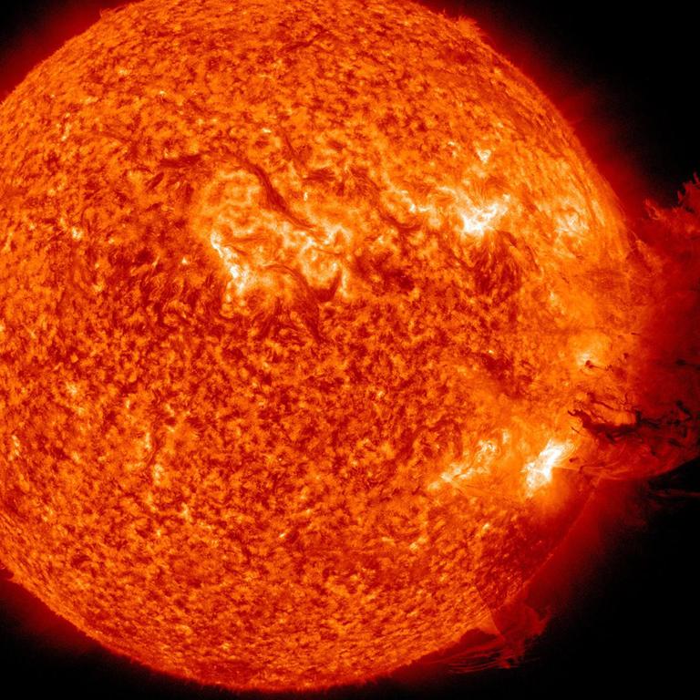 Image provided by NASA shows the Sun unleashing a medium-sized solar flare, a minor radiation storm and a spectacular coronal mass ejection on 07/06/2011. The large cloud of particles mushroomed up and fell back down looking as if it covered an area of almost half the solar surface and the ejection should deliver a glancing blow to Earth's magnetic field during the late hours 08/06/2011.