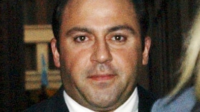 Melbourne, September 4, 2002. The alleged boss of a $2 million drugs syndicate Antonios "Tony" Mokbel" leaves the supreme court this evening after he regained his freedom when a Supreme Court judge granted him bail.  Justice Murray Kellan ruled that Mokbel faced undue delays in in his case proceeding because of a corruption investigation into members of the former Victorian Drug Squad who are witnesses in the charges against Mokbel. (AAP Image/Julian Smith) NO ARCHIVING