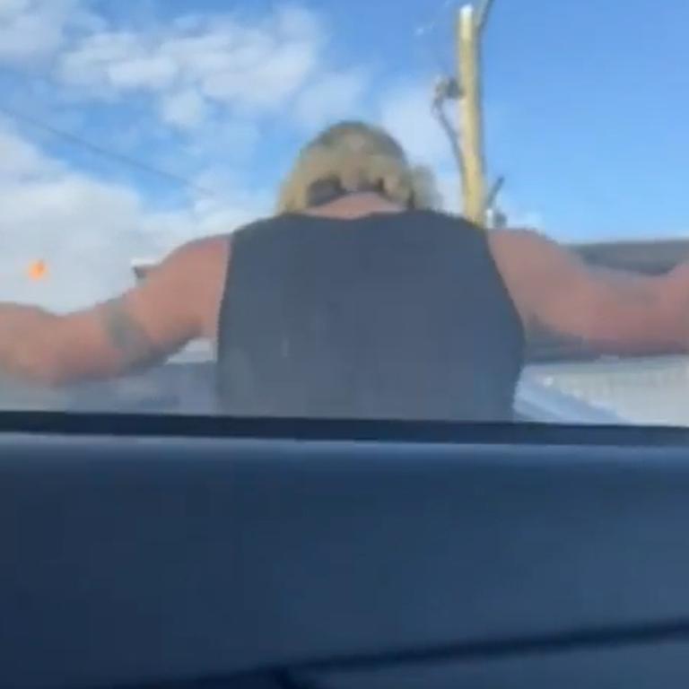 Shocking footage shows a man smashing a car window. Picture: 9News