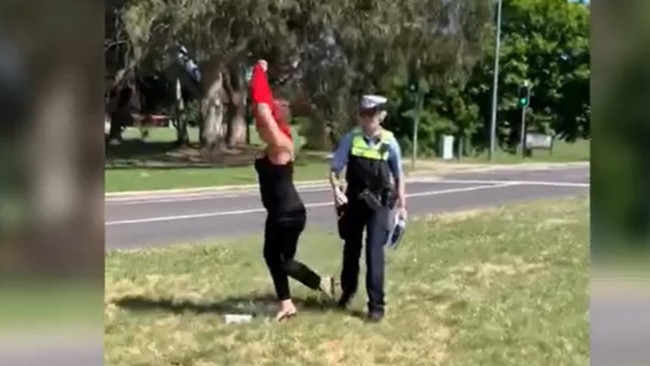 Senator Thorpe argues with a police officer while protesting in Canberra as King Charles visits Australia. Picture: NewsWire