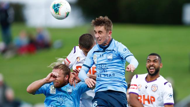 Joel King heads the ball during the A-League match against Perth Glory.