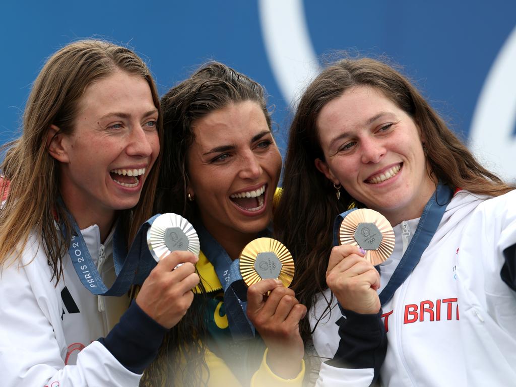Jessica Fox of Team Australia, centre, with silver medallist Klaudia Zwolinska of Team Poland, left, and bronze medallist Kimberley Woods of Team Great Britain, right pose for a selfie after the medal presentation. Picture: Francois Nel/Getty Images