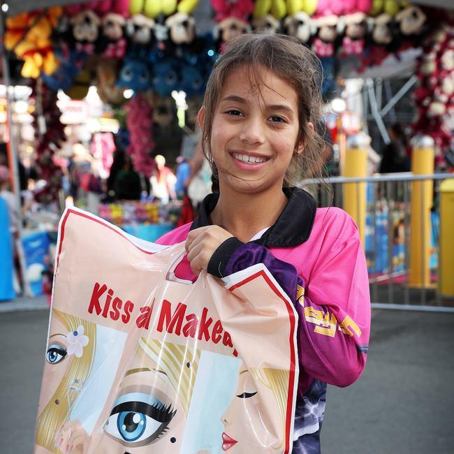 Leia Wriede, 8, with her Kiss and Makeup show bag, EKKA, Bowen Hills. Picture: Liam Kidston