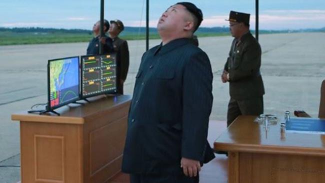 An undated photo shows Kim Jong-un apparently watching a missile launch. Picture: KCNA