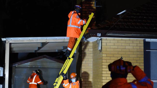 SES clearing the debris from a veranda that blew up onto the roof of this house in Woorite Place, Keilor East. Picture: Josie Hayden