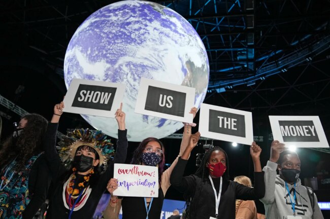 Activists demanding climate finance and debt relief for countries exposed to the effects of climate change protest at an impromptu demonstration at the UNFCCC COP27 climate conference on November 9, 2022 in Sharm El Sheikh, Egypt.