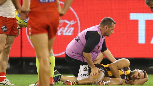 Jarman Impey on the ground after being bumped in the head by Sydney's Luke Parker. Pic: Michael Klein