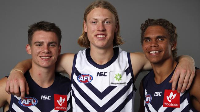 Three’s company for the Dockers with new men Caleb Serong, Hayden Young and Liam Henry. Picture: AFL Photos/Getty Images