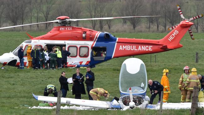 Paramedics and emergency crews load the man onto the air ambulance. Picture: Jay Town