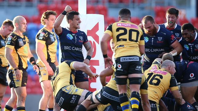 Matt Toomua of the Rebels celebrates the match winning try scored by Efitusi Maafu. Picture: Jason McCawley/Getty Images