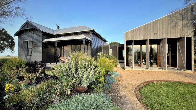 The luxury home on the property includes four bedrooms, two bathrooms, a separate study and studio. Picture: realcommercial.com.au