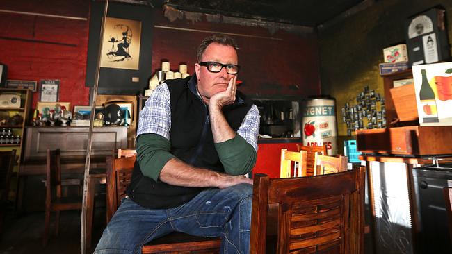 Red Velvet Lounge owner Steve Cumper in the fire, smoke and water damaged dining room