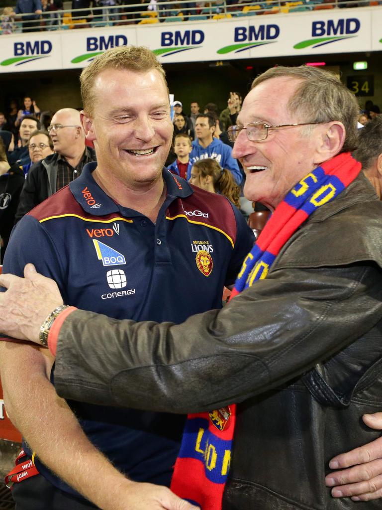 Then-Lions coach Michael Voss and Fitzroy legend Kevin Murray celebrate after a Lions win in 2012. Picture: Darren England.