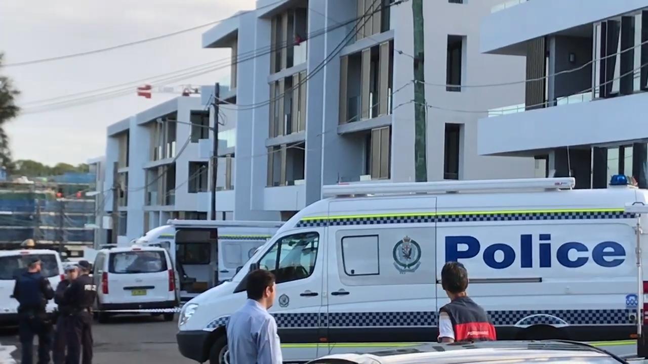 Police and detectives on scene at Mortlake shooting