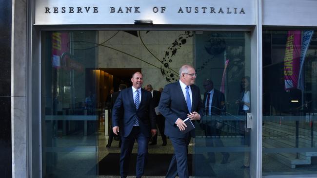 Scott Morrison and Josh Frydenberg leave the RBA building after meeting Governor Philip Lowe. Pic: AAP