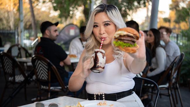 Julia Truong, aka @blondeasian enjoys some carbs at Sneakies Kitchen in Homebush. Picture: Monique Harmer