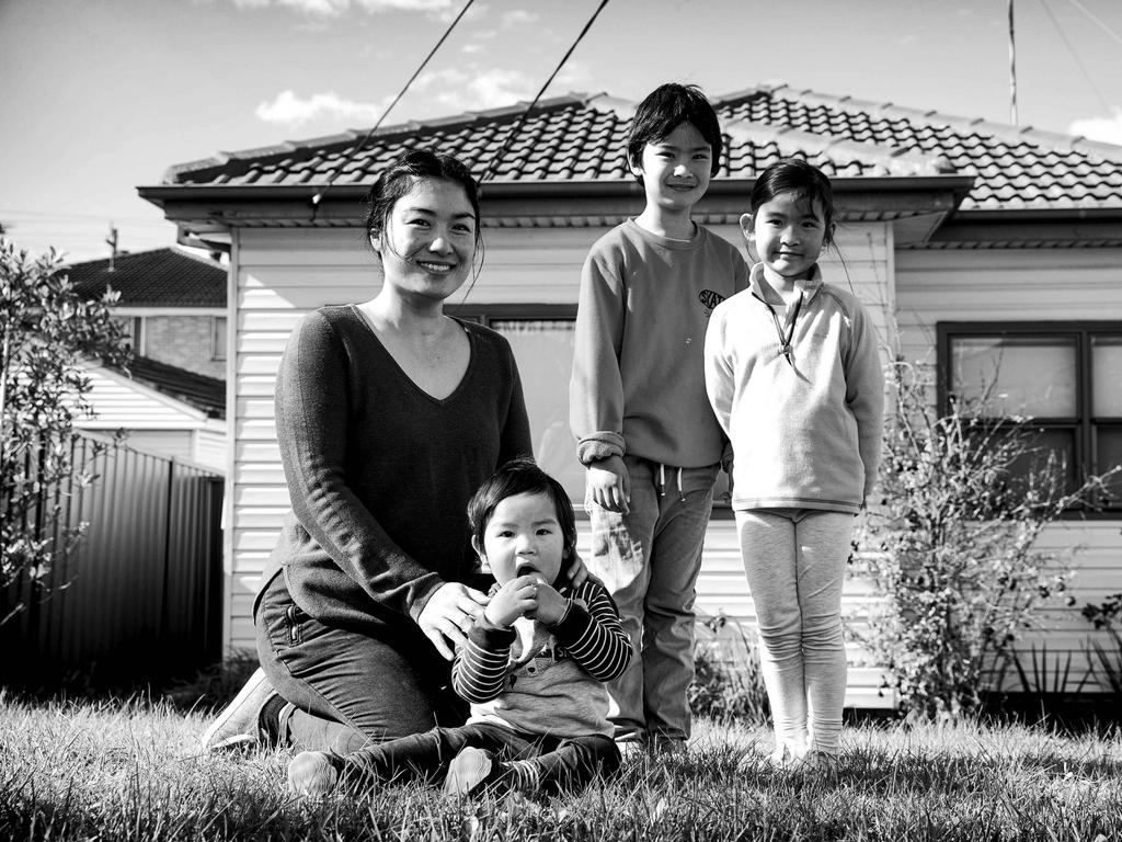 FACES OF LOCKDOWN: Mum Hong who is a part-time teacher at Cabramatta pictured with her children Callum, 7, Eloise, 5, and Theo, 1. Picture: Christian Gilles