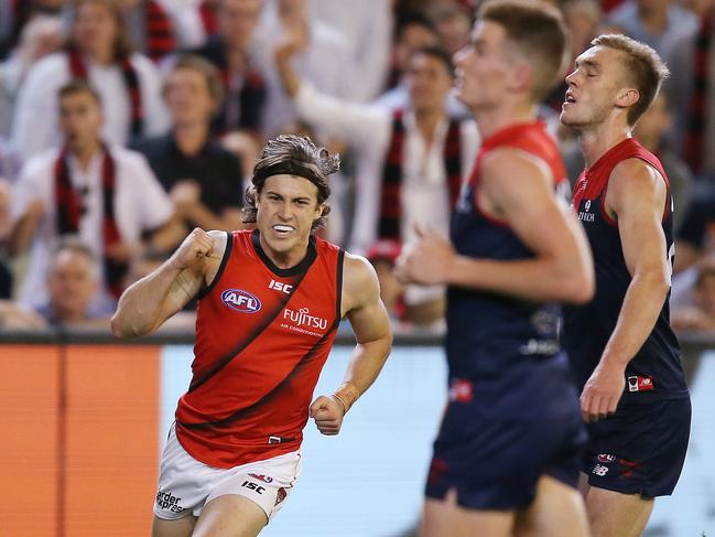 Andrew McGrath celebrates the sealer as the Demons lament. Picture: Getty Images