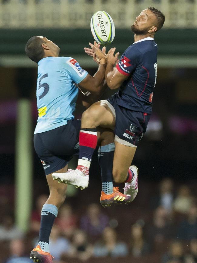 Beale and Quade compete in the air. Picture: AAP