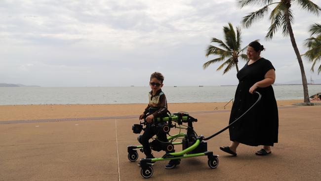 6-year-old Jordan King with his mum Ashlee King using the Trexo Robotic Walker at The Strand.