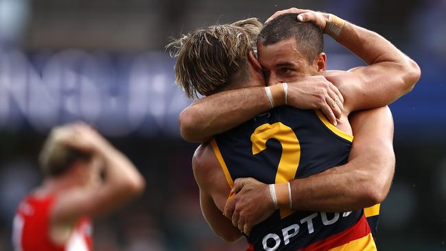 Ben Keays and Taylor Walker celebrate another goal during their heavy defeat. Picture: Getty Images