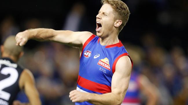 MELBOURNE, AUSTRALIA - MAY 09: Lachie Hunter of the Bulldogs celebrates a goal during the 2021 AFL Round 08 match between the Western Bulldogs and the Carlton Blues at Marvel Stadium on May 09, 2021 in Melbourne, Australia. (Photo by Michael Willson/AFL Photos via Getty Images)