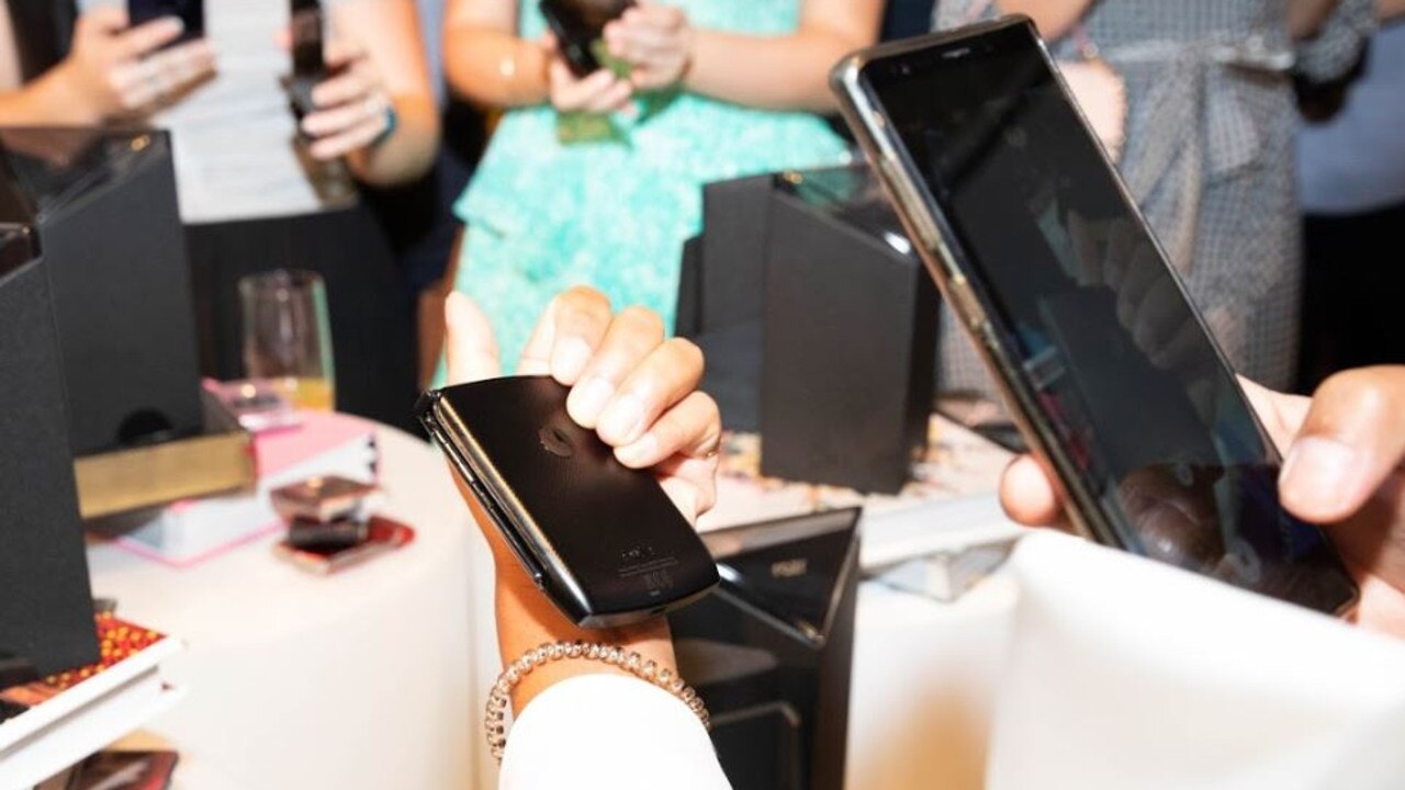 An attendee photographs the new Motorola Razr at a launch event in Sydney.