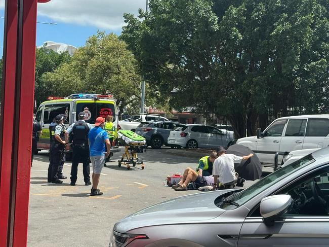 Emergency services at the scene of a vehicle and motorbike crash at Sheridan St, Cairns. Picture: Samuel Davis