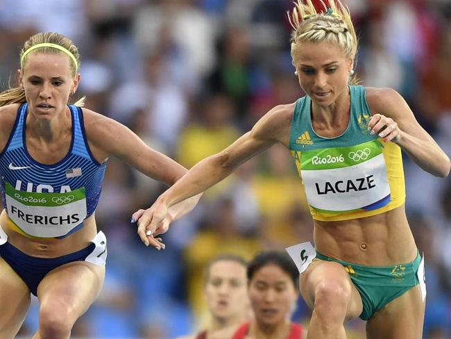 (L-R) Kenya's Hyvin Kiyeng Jepkemoi, USA's Courtney Frerichs, and Australia's Genevieve Lacaze compete in the Women's 3000m Steeplechase Round 1 during the athletics event at the Rio 2016 Olympic Games at the Olympic Stadium in Rio de Janeiro on August 13, 2016. / AFP PHOTO / Fabrice COFFRINI