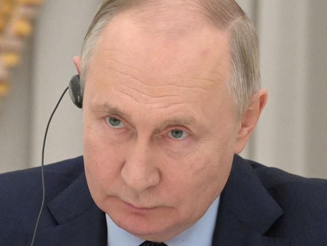 In this pool photograph distributed by Russian state agency Sputnik, Russia's President Vladimir Putin attends a meeting with Indian foreign minister in Moscow on December 27, 2023. (Photo by Alexey NIKOLSKY / POOL / AFP)